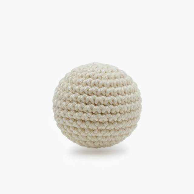 Finished cream-white crocheted amigurumi sphere made from this pattern